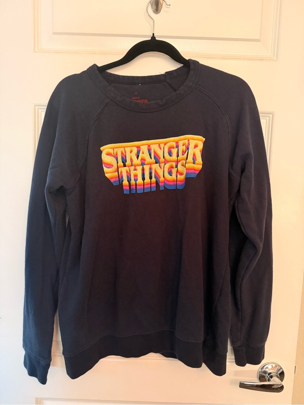 Netflix Navy Crewneck Sweatshirt with Multicolor 'Stranger Things' Logo